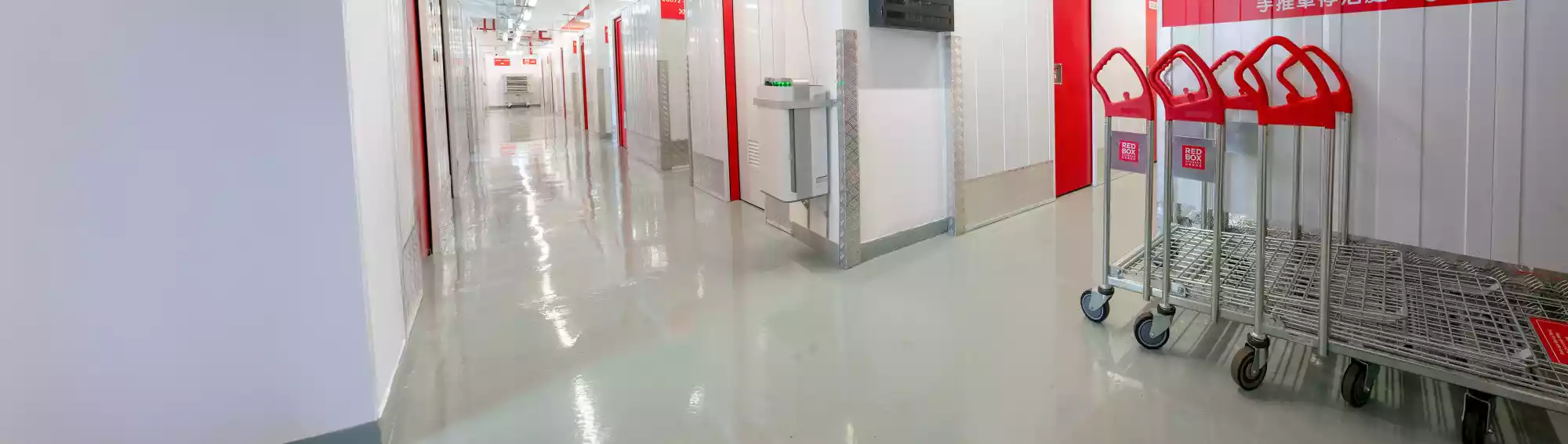 RedBox Mini Storage Chai Wan - Storage unit corridor with trolleys