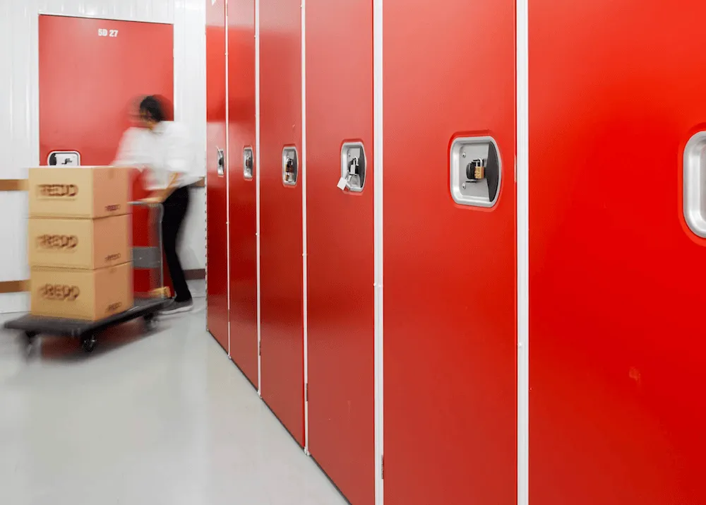 REDD Suan Luang interior corridor with red storage unit doors
